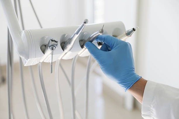 Professional Tooth Extraction technician working in North Boston, NY